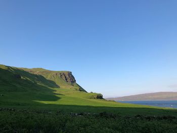 Scenic view of mountains against clear blue sky