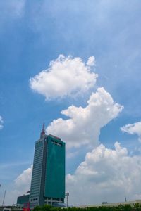 Low angle view of built structure against cloudy sky