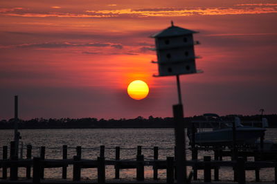 Scenic view of sea against orange sky