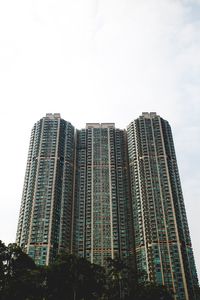 Low angle view of modern buildings against sky