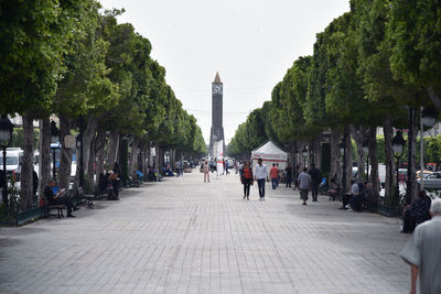 Group of people walking in city street