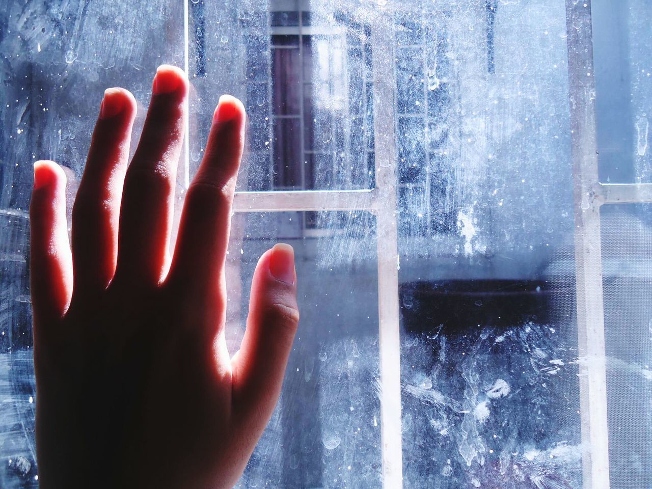 person, part of, cropped, human finger, personal perspective, unrecognizable person, holding, close-up, indoors, window, glass - material, transparent, water, reflection, day, focus on foreground, wall - building feature