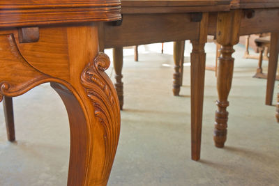 Close-up of wooden table in building