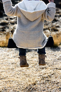 Low section of child in swing