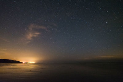 Scenic view of sea against sky at night