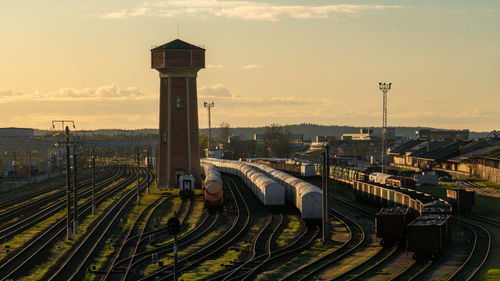 High angle view of railroad tracks against sky during sunset