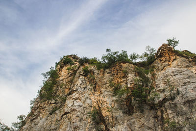 Low angle view of rock formation against sky