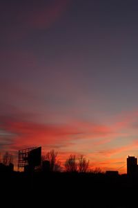 Silhouette of building at sunset