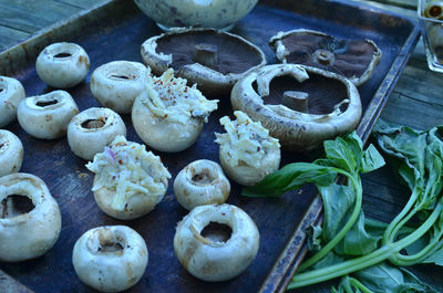 Preparation of stuffed white mushroom appetizers for grilling