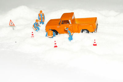 Toy car on snow covered land