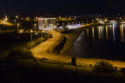 High angle view of light trails on road at night