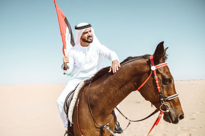 Man riding horse