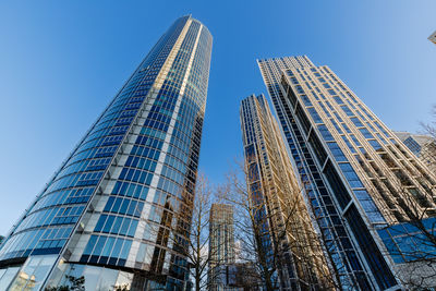 Low angle view of skyscrapers against clear sky