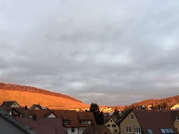 Houses in town against sky