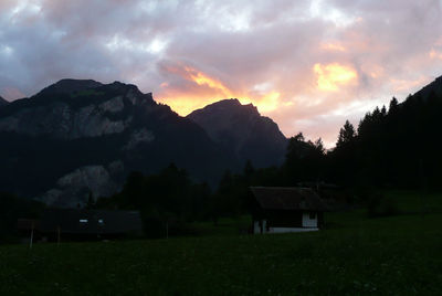 Scenic view of field against sky during sunset