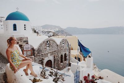 High angle view of woman by sea against sky