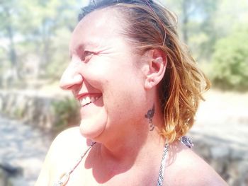 Close-up portrait of a smiling young woman