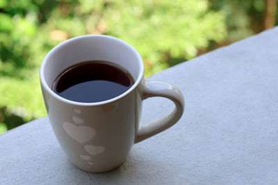 High angle view of coffee cup on table