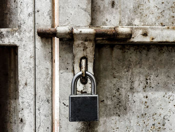 Close-up of padlock on metal door