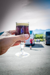 Close-up of hand holding wine glass