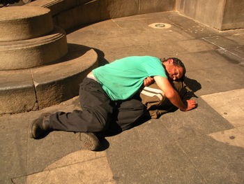 High angle view of man and shadow on floor