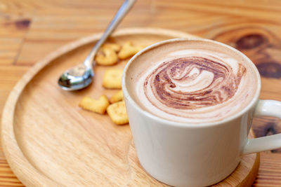 Close-up of cappuccino on table