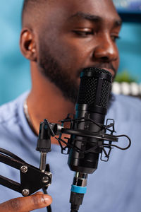 Close-up of man playing guitar