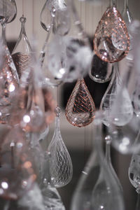 Close-up of christmas decoration hanging on glass