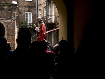 Woman standing by railing