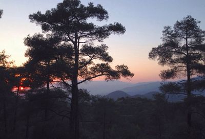 Scenic view of landscape against sky at sunset