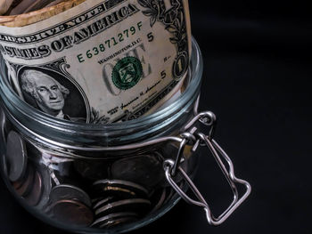High angle view of glass jar on black background