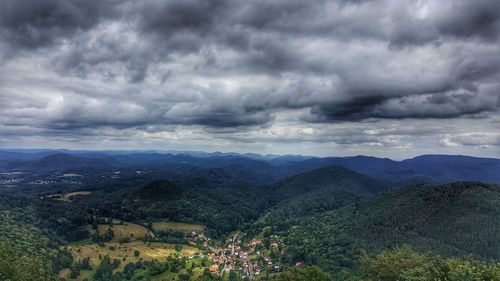 Scenic view of storm clouds over landscape