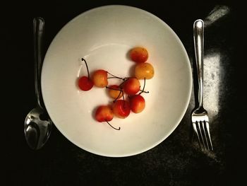 High angle view of tomatoes in plate on table