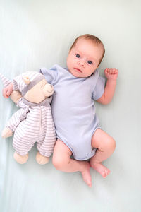 Cute baby boy with teddy bear