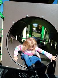 Rear view of girl in playground