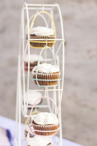 Close-up of cupcakes in stand on table