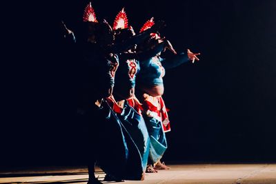 Low angle view of woman dancing at nightclub