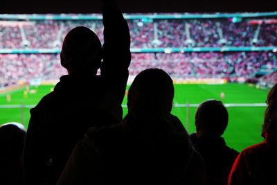 Silhouette people at the stadium