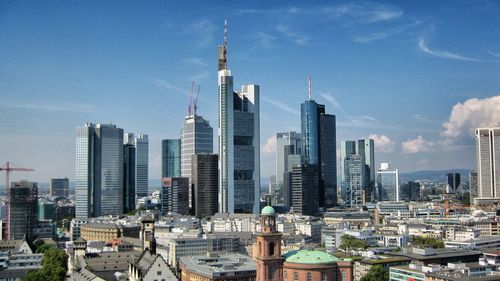 Modern buildings in city against sky