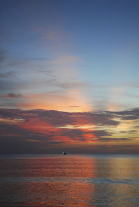 View of calm sea at sunset