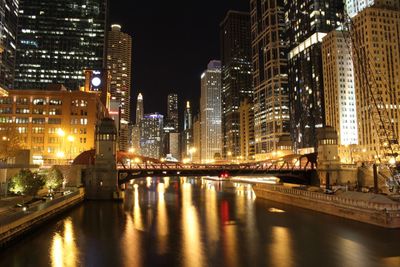 Illuminated city at waterfront