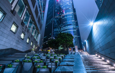 Low angle view of modern buildings in city at night