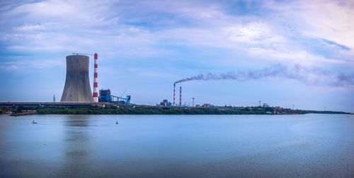 Panoramic view of factory against sky