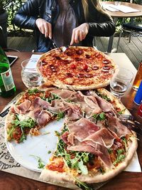 Midsection of pizza on table