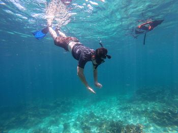 Man swimming in sea