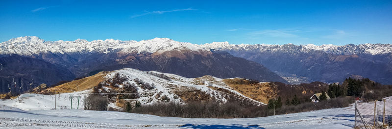 Scenic view of snowcapped mountains against sky