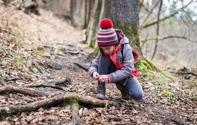 Full length of a boy in forest