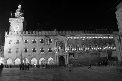 Group of people in historic building at night
