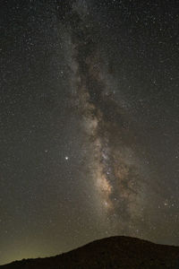 Scenic view of star field against sky at night