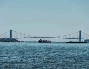 View of suspension bridge over sea